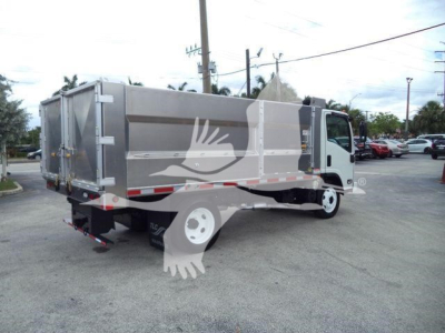 2017 Chevrolet W4500 dump truck rear and side view showing cargo bed and cab in a dealership lot