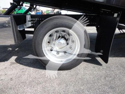 Mack MD6 truck wheel and suspension side view showing wheel, hubcap, and undercarriage components.