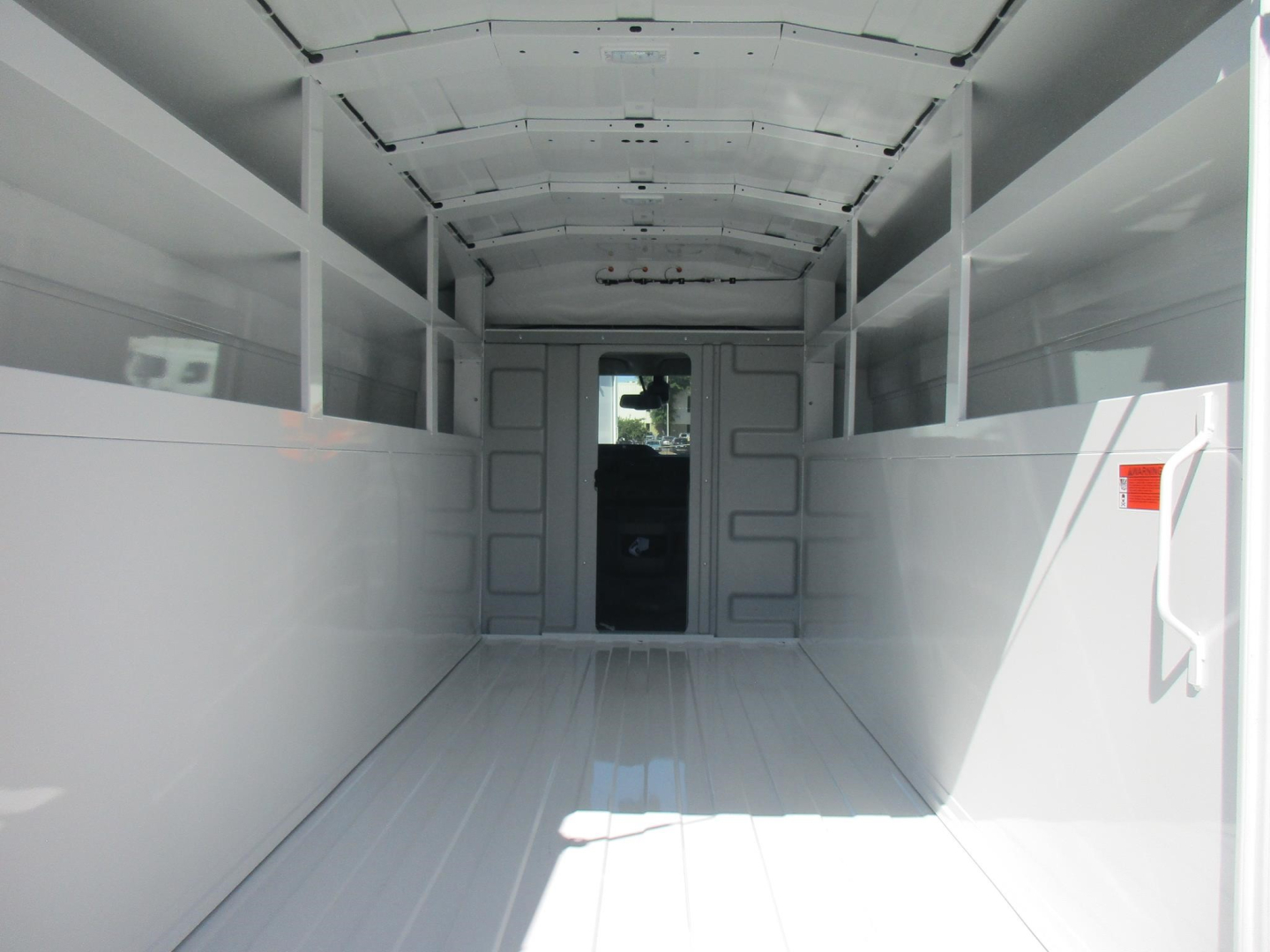 Ford E-350 service/utility cargo van interior cargo area empty wide ramp door open