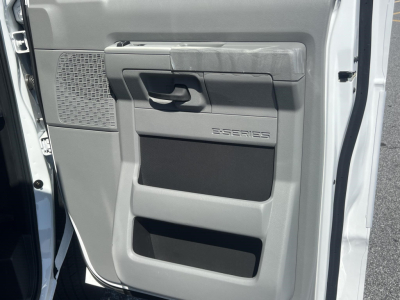 Ford E-Series E-Series cargo van interior door panel showing door handle and storage pockets.
