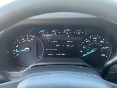Ford instrument cluster in a 2026 E350 dashboard showing tachometer, speedometer, and digital display with trip data.