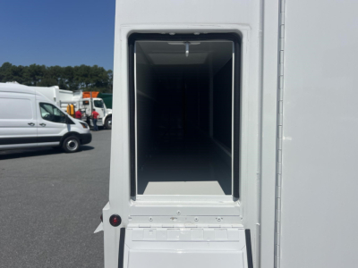 Service/Utility truck cargo bay open showing empty interior with raised floor and rear door frame.