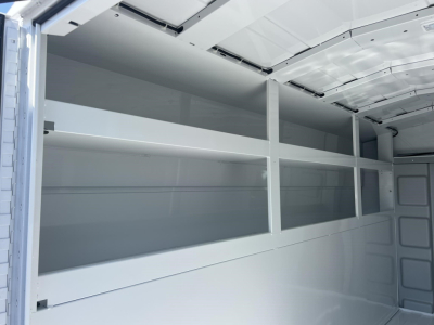 Ford E-350 service/utility van interior shelving in cargo area with multiple metal shelves.
