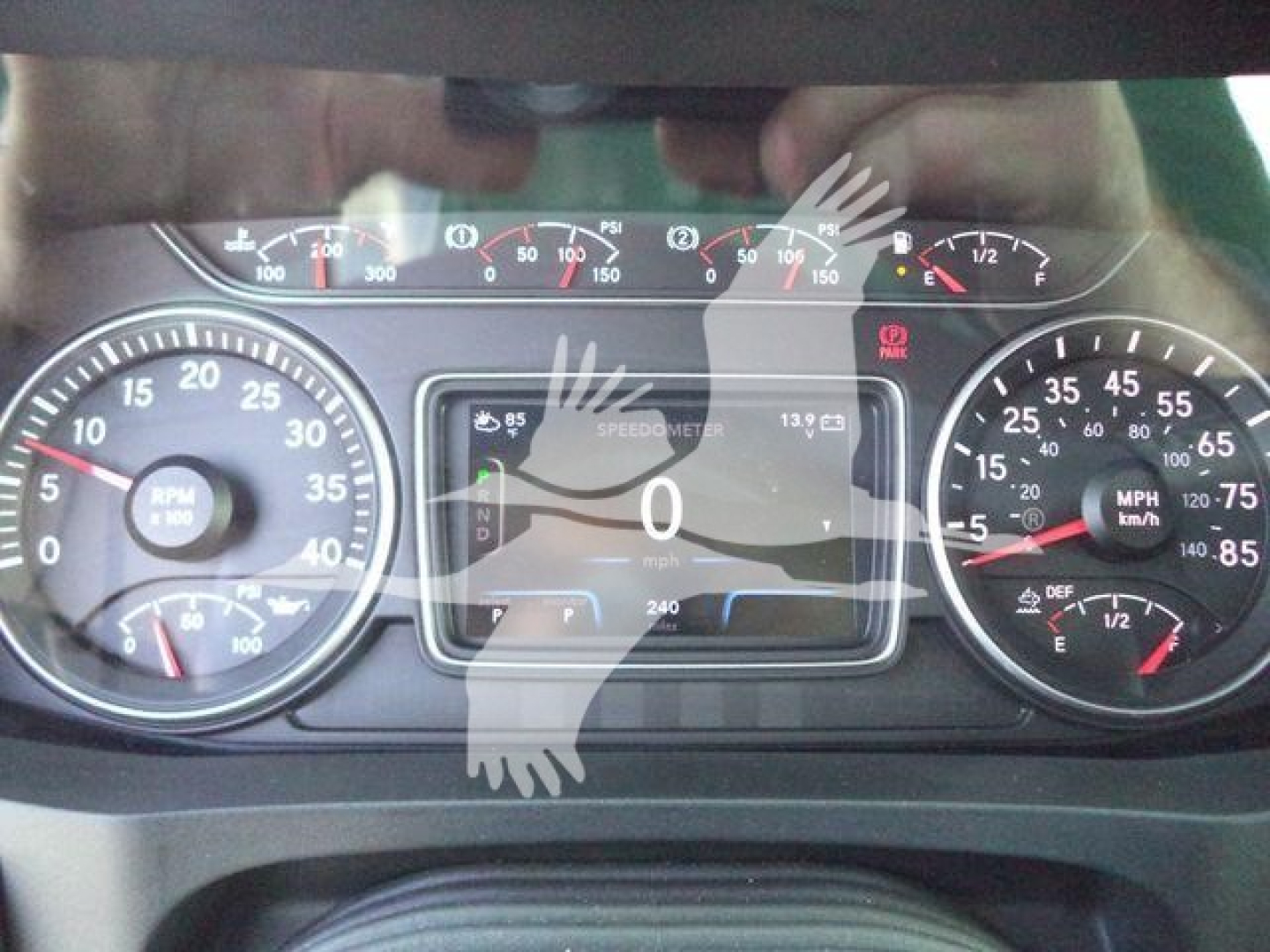 Dashboard view of a 2027 International MV rollback truck showing instrument cluster, speedometer, and digital display.