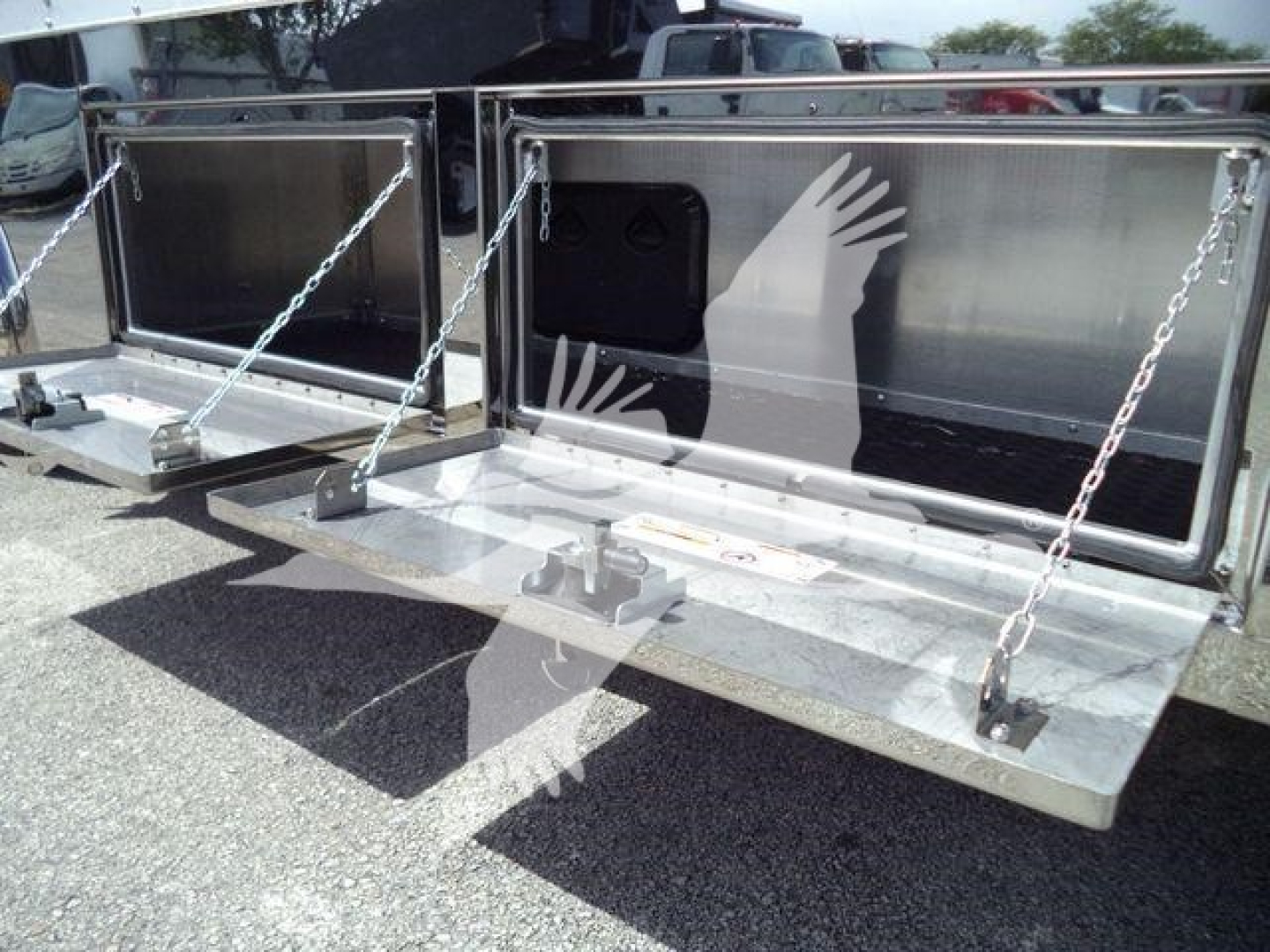 Truck rollback bed with metal gates and Chains, dual compartment storage open tailgates showing interior panels