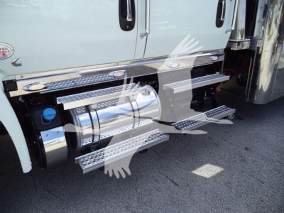 Trucks side view showing chrome cylindrical fuel tank and aluminum step rails along the cab of a 2027 International MV rollback truck.