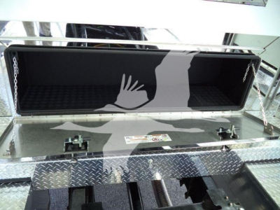 Truck bed toolbox hatch open showing interior and diamond plate exterior