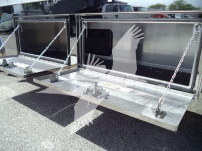Truck rollback bed with metal gates and Chains, dual compartment storage open tailgates showing interior panels