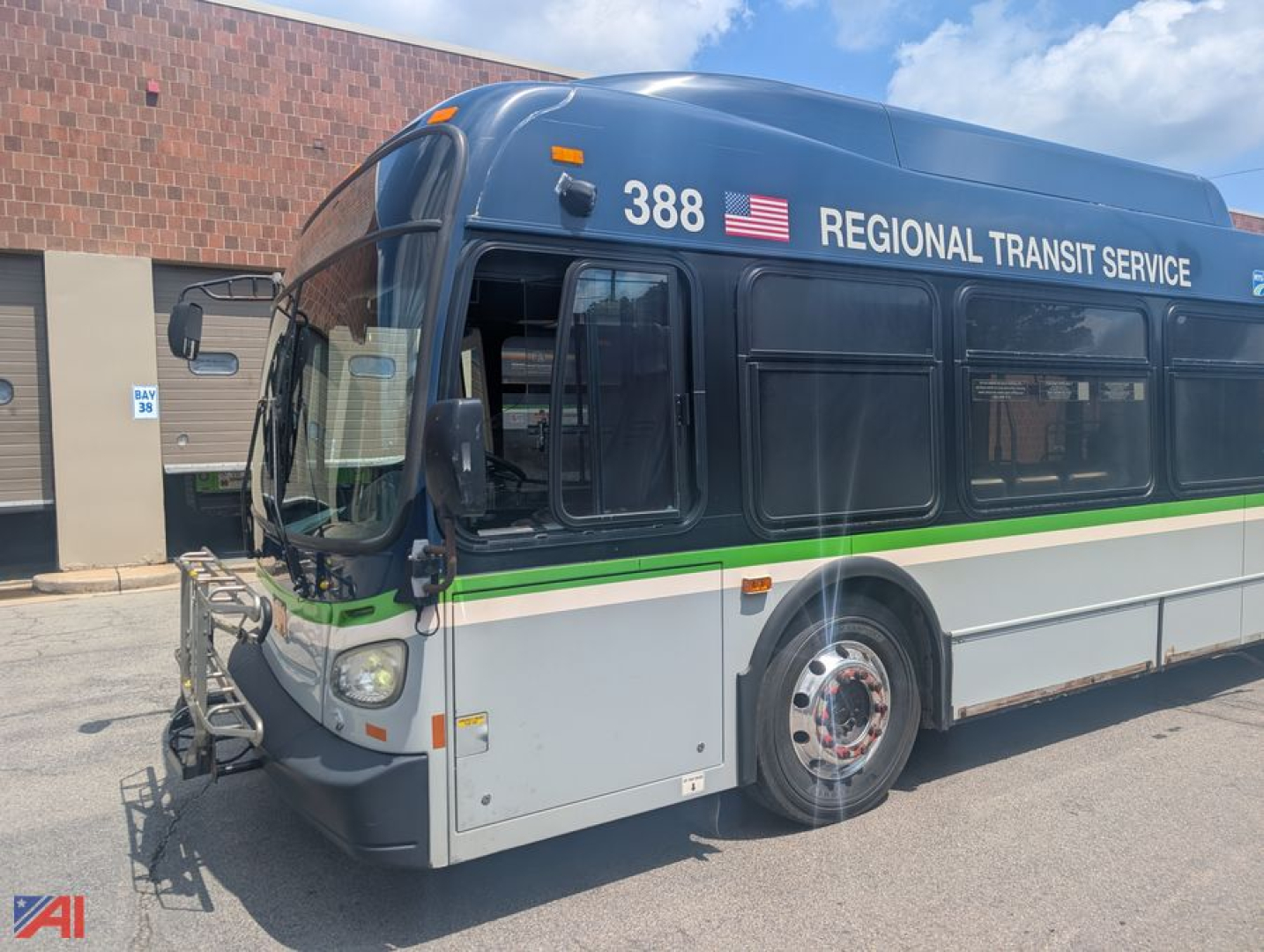 Bus front quarter showing XD60 transit bus with blue upper, green stripe, Regional Transit Service lettering, number 388.
