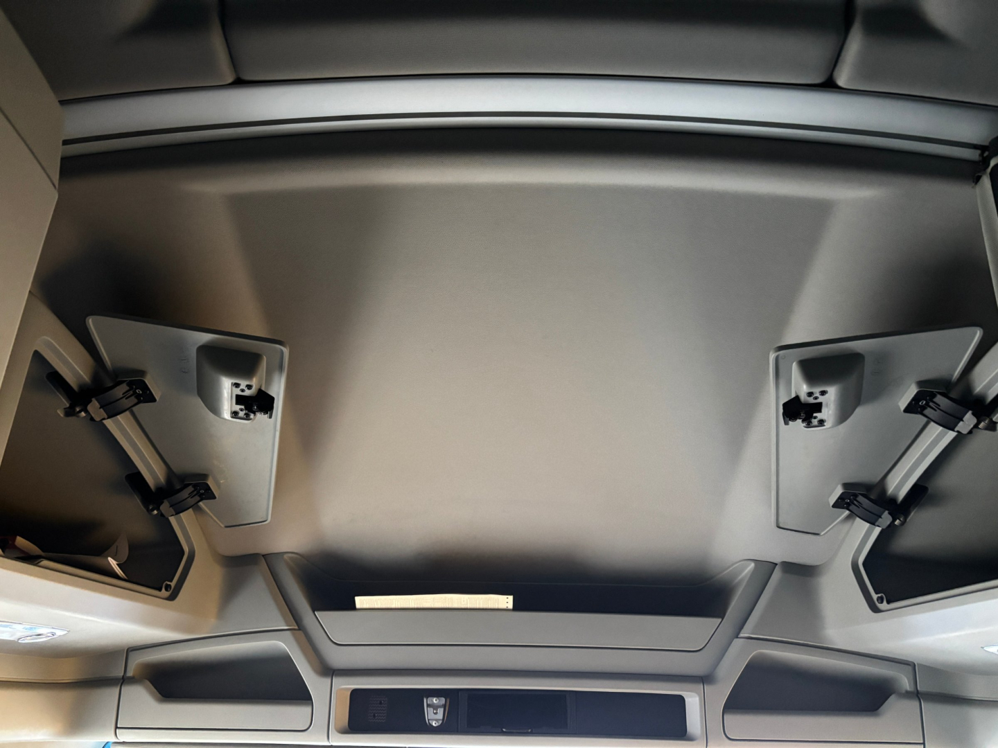 Kenworth T680 interior ceiling panels and hatch area in view from cabin, no visible text or labels.