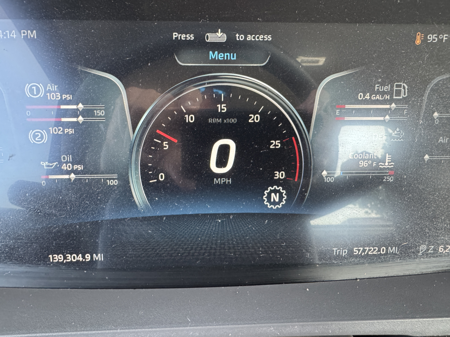 Kenworth T880 instrument cluster showing digital speedometer at 0 MPH, RPM gauge, fuel and coolant gauges, and vehicle readouts; odometer reads 139,304.9 miles, trip 57,722.0 mi.