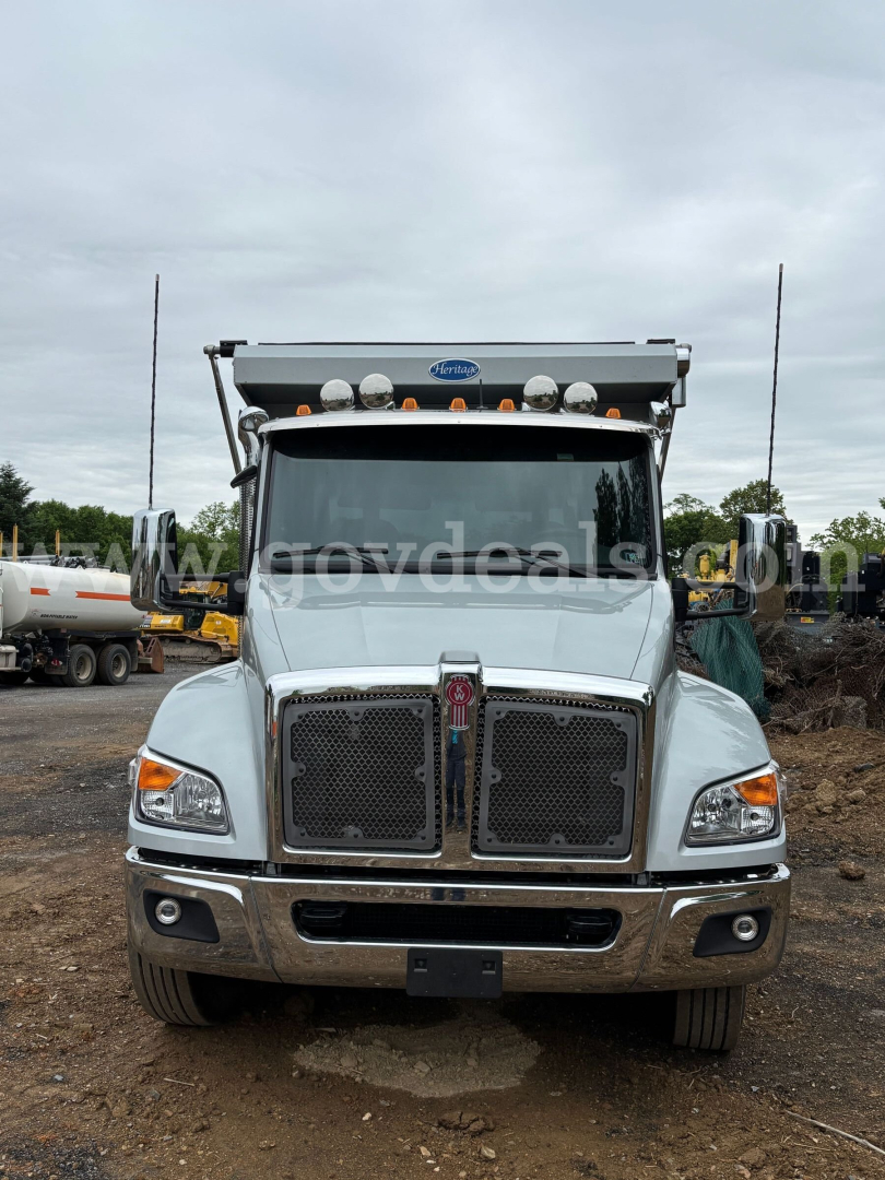 Kenworth T380 dump truck front view showing chrome grille, dual headlights, and cab-mounted lights.