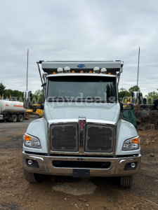 Kenworth T380 dump truck front view showing chrome grille, dual headlights, and cab-mounted lights.