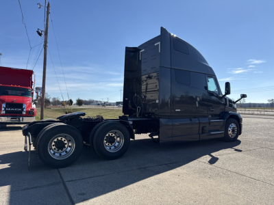Mack PR64T76H truck tractor side view showing rear tandem wheels and fuel/oil lines.
