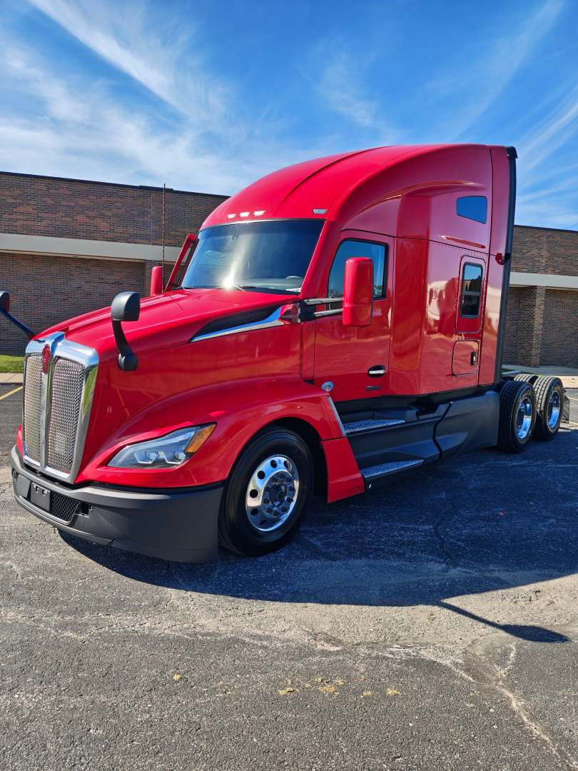 Kenworth T680 2024 red semi-truck in sleeper configuration showing front grille and cab profile.