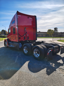 Kenworth T680 truck rear view showing sleeper cab and dual rear axles with wheels