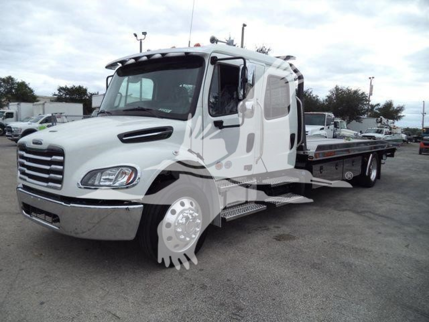 2027 Freightliner M2 106 rollback truck showing side view with extendable flatbed and cab interior visible.