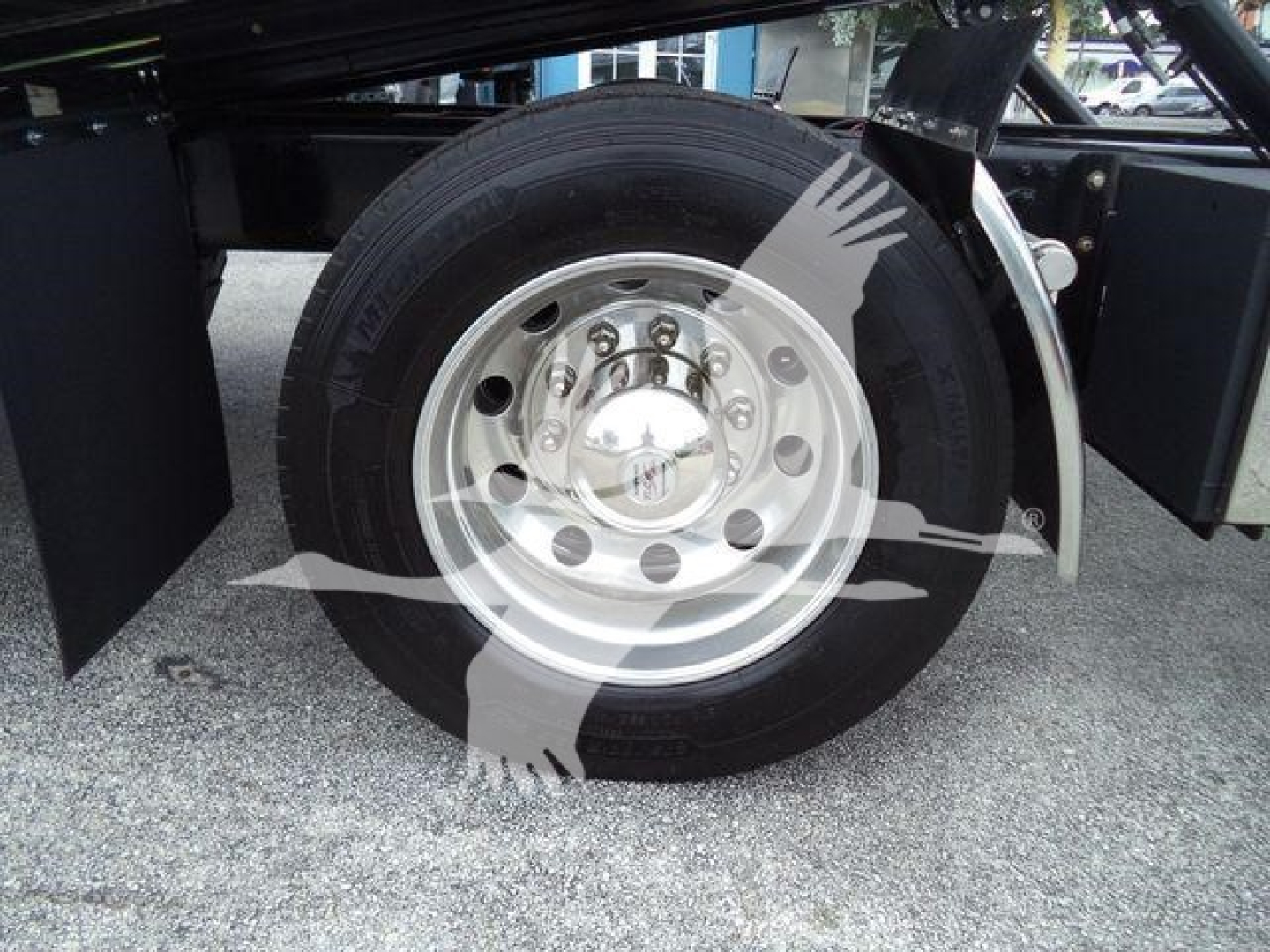 Truck wheel with alloy rim and treaded tire in Freightliner M2 106 setup