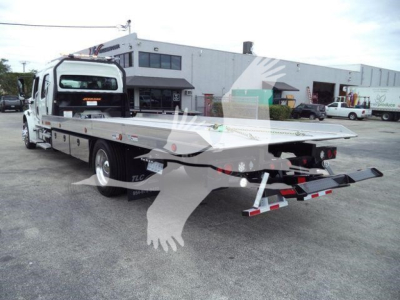 Flatbed tow truck with wheel-lift showing the flatbed and rear ramps, Freightliner M2 106 in-service utility body.