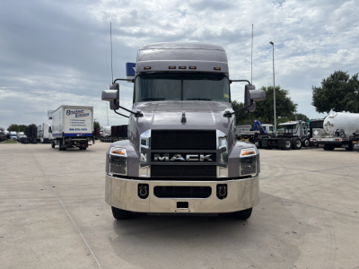 Mack AN64T70 conventional sleeper truck front view showing chrome bumper and grille with large MACK logo, headlights, and cab mirrors.
