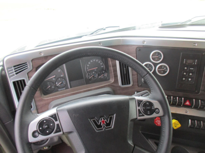 Western Star truck dashboard and steering wheel view in-cab showing instrument cluster and controls.