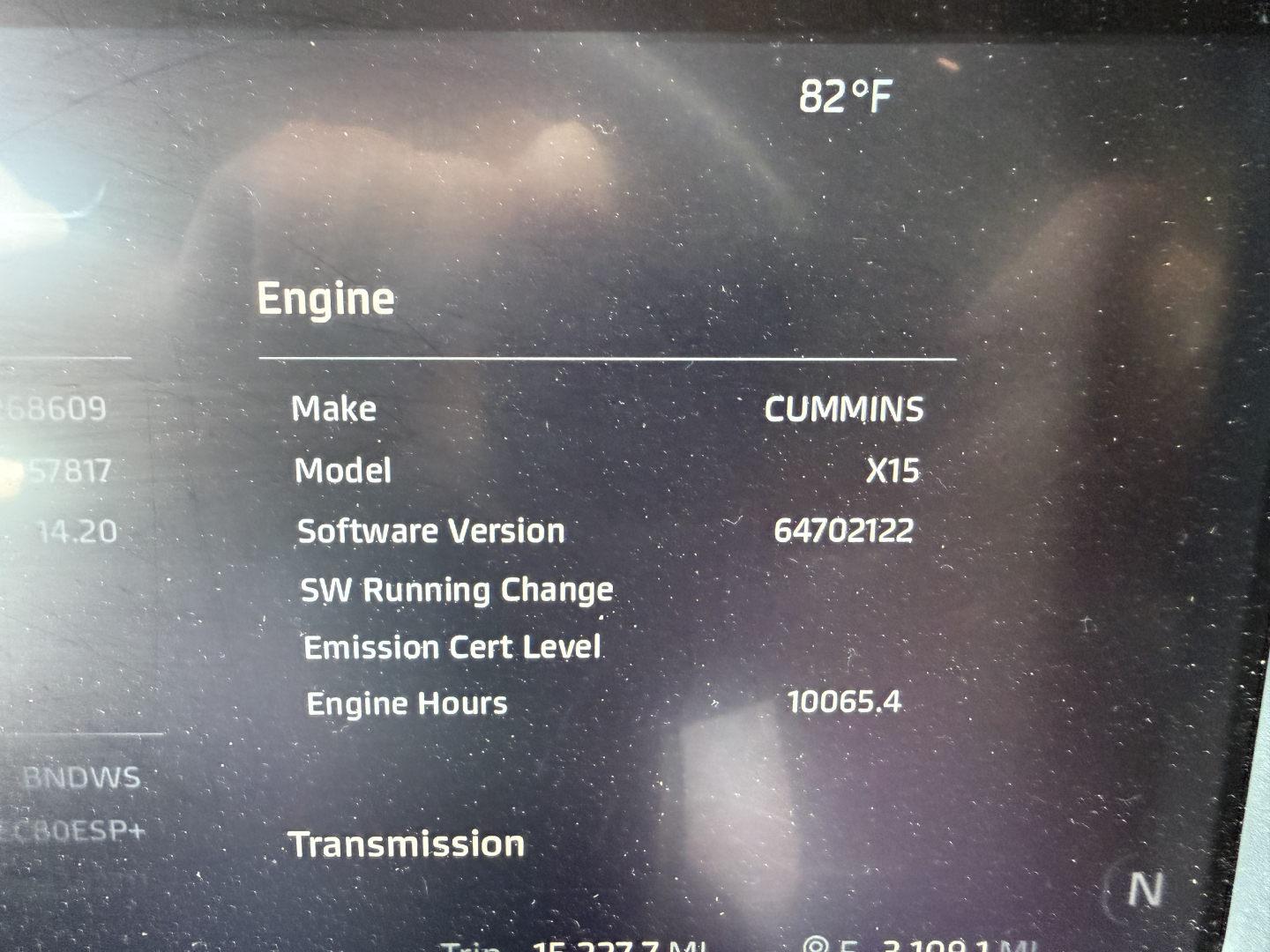 Engine information from Kenworth dash: Make Cummins, Model X15, Software Version 64702122, Engine Hours 10065.4, Emission Cert Level, Transmission. Temperature 82°F.