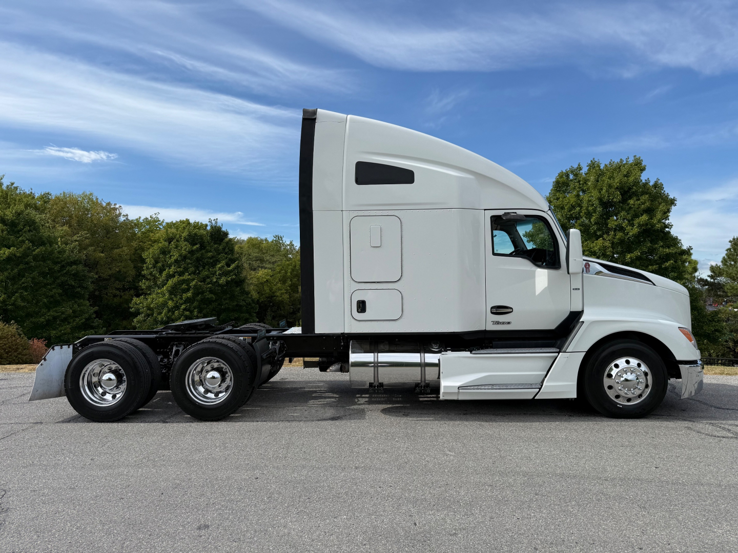 Kenworth T680 tractor in profile showing side view with sleeper cab and dual rear axles.