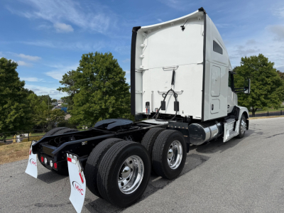 Kenworth T680 tractor rear view showing sleeper cab and dual rear axles with wheels. No visible text on components in the image.