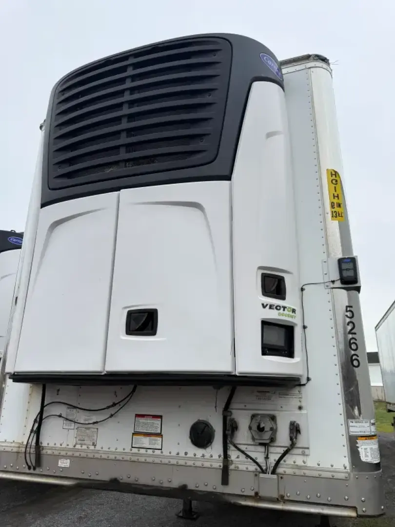 Great Dane Everest multi-temp refrigerated trailer showing front unit with black cooling system and white body, vertical data plate on right side, VIN tag partially visible.