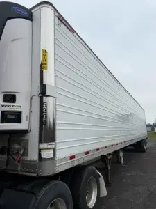 Great Dane Everest multi-temp refrigerated trailer showing side panel, rear doors, and Carrier refrigeration unit.