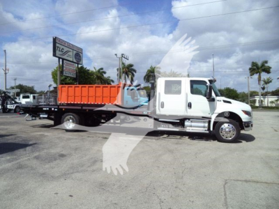 2026 International MV roll-back truck with white cab and orange dump bed, side view.
