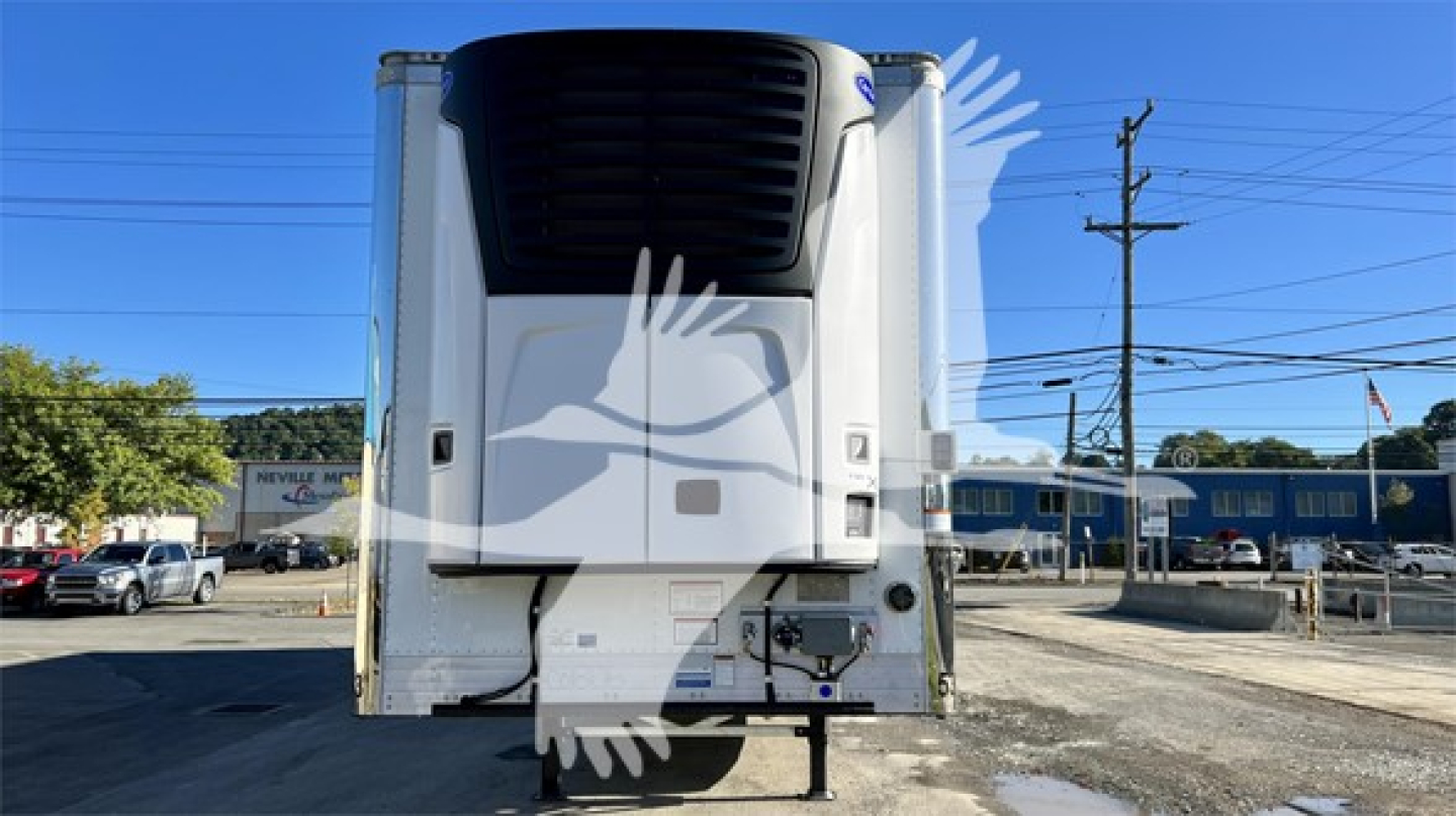 Refrigerated trailer rear view showing cooling unit, bumper hitch, and accessible service panels.