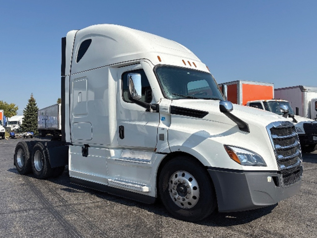 Truck cab of a 2022 Freightliner Cascadia126 conventional sleeper showing front view.