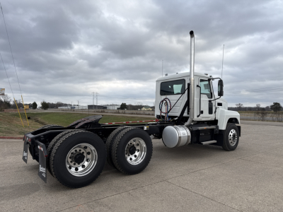 Semi truck chassis and cab showing PI64T with dual rear axles and exhaust stack.