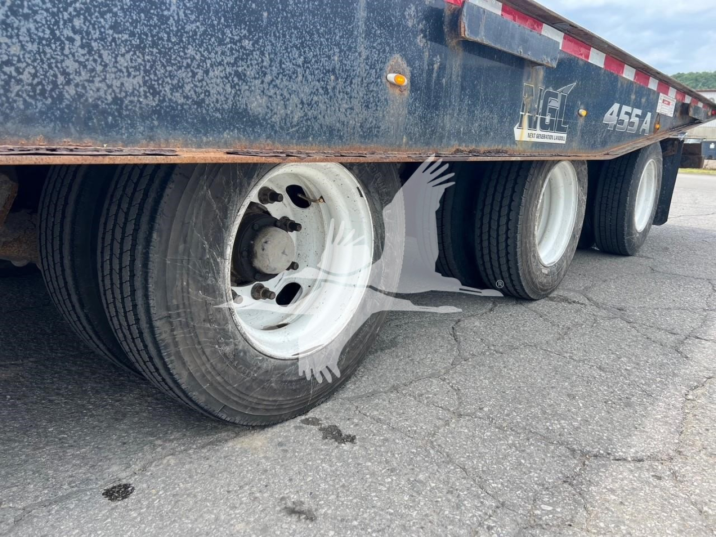 Landoll 455A-53 trailer showing dual rear axles and white wheels