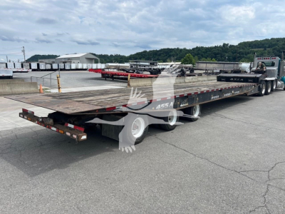 Trailer showing a Landoll 455A-53 lowboy with a long deck and multiple axles, flatbed surface, semi-truck in background, stock number 7531 visible.