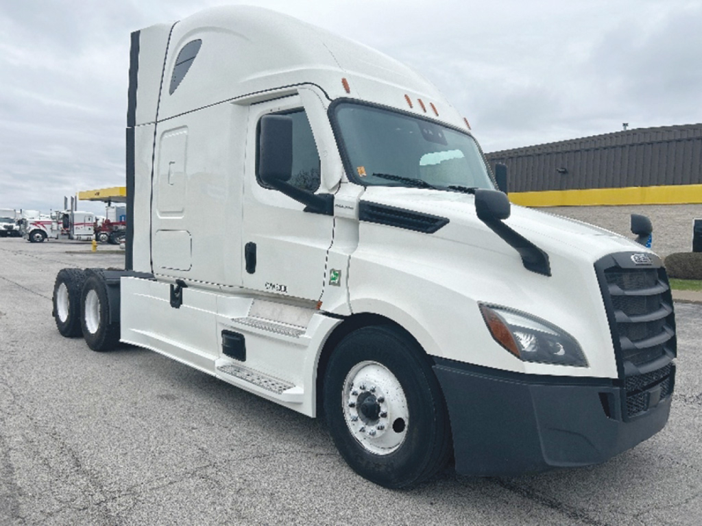 Freightliner Cascadia 126 sleeper cab tractor in white, front three-quarter view, showing cab with aerodynamic mirrors and large grille.