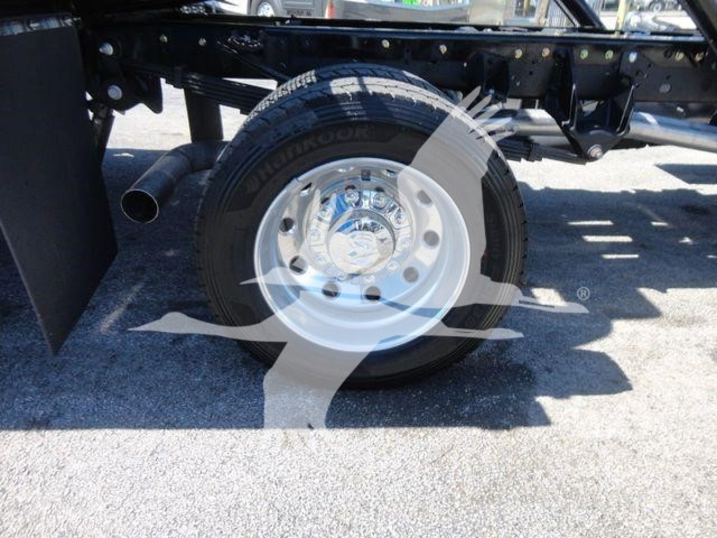 Ram 5500 SLT rollback truck rear wheel and chassis view showing heavy-duty tire and steel rim with surrounding frame components.