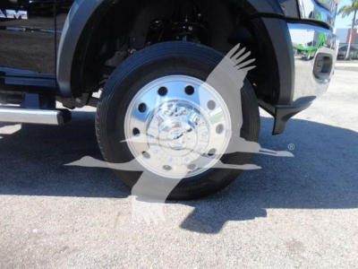 Ram 5500 front wheel and chrome hubcap showing wheel and tire with vehicle fender and side step visible