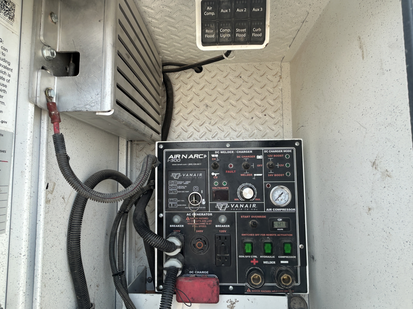 Mack MD642 service truck interior showing Ryanair air conditioning control panel and diagnostic gauges.