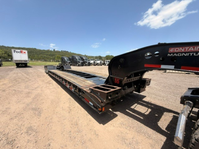 Lowboy trailer with MAG55H Fontaine load deck showing long steel frame and hydraulic gooseneck area