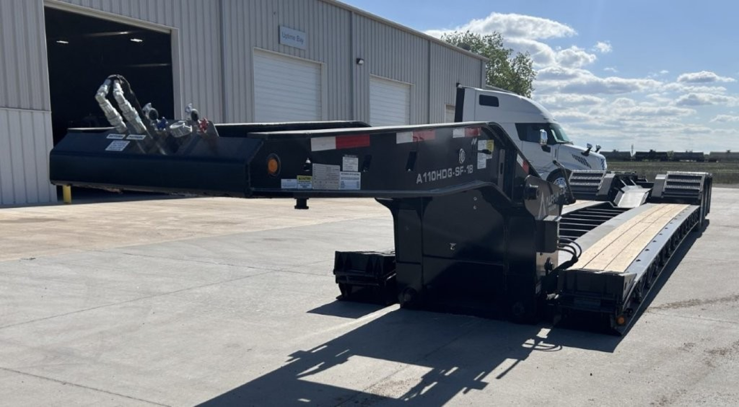 Lowboy trailer showing A110HDG-SF-18" LDH model with long deck, black frame, and gooseneck-style hitch.
