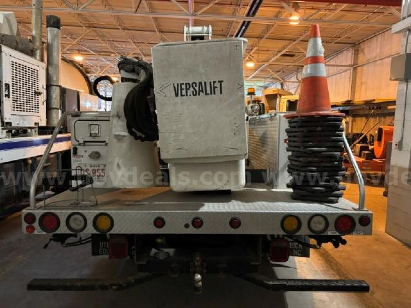 Back of a utility truck with VEP SALIFT equipment and orange traffic cone on the bed.