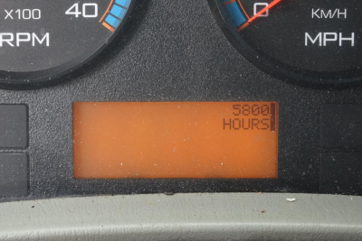Truck gauge cluster displaying an orange digital odometer reading '58001 HOURS' near the center bottom of the dashboard.