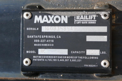 Maxon Railift lift gate series plate on a vehicle showing serial number, Santa Fe Springs CA, 800-227-4116, MADE IN MEXICO, MODEL RC, CAPACITY 4000 LBS, P/N 905246-4.