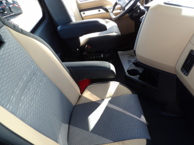 Truck cab interior showing front seats and dashboard of a 2025 Mack GR104F.