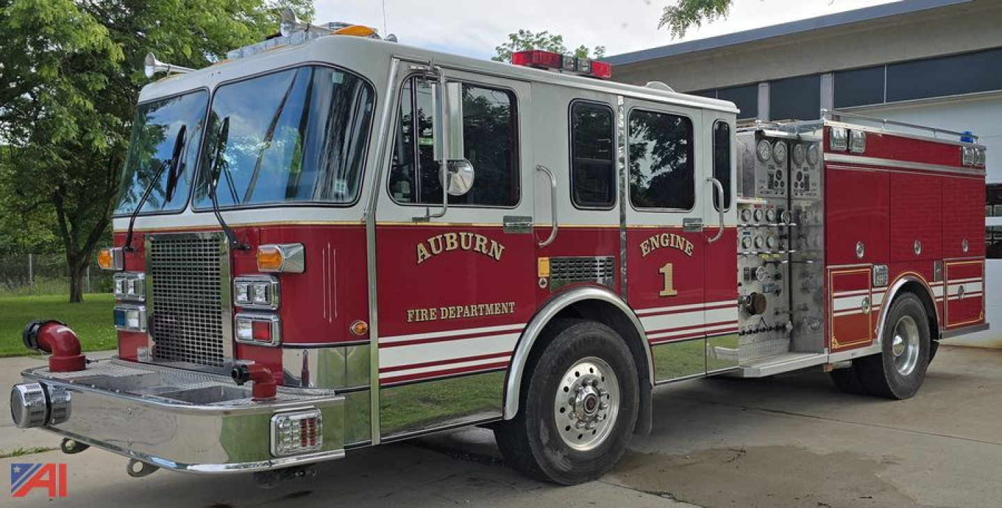 Fire truck side view showing Auburn Fire Department engine with red and silver livery and chrome accents.