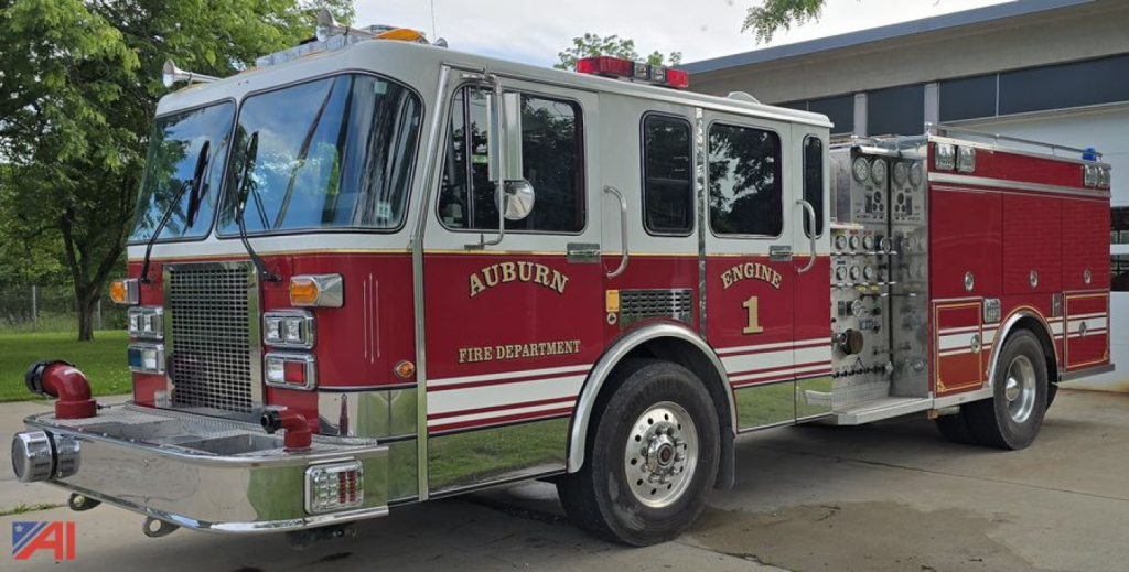 Fire truck side view showing Auburn Fire Department engine with red and silver livery and chrome accents.