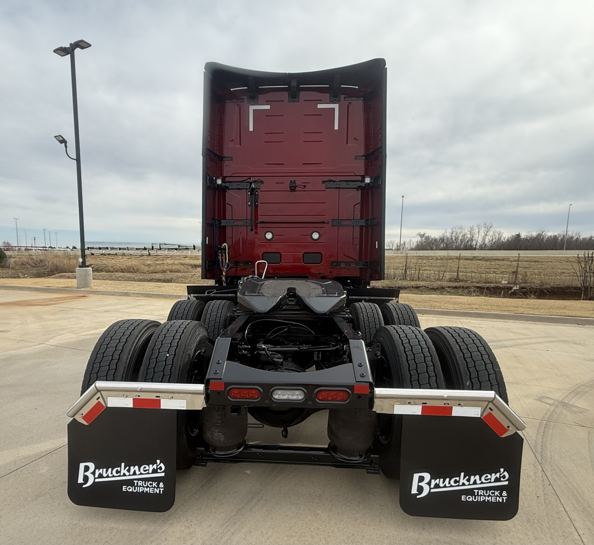 Rear view of a new 2026 Mack PR64T76H tractor chassis showing dual rear axles, fifth-wheel, and mudflaps with Bruckner's Truck Equipment branding.