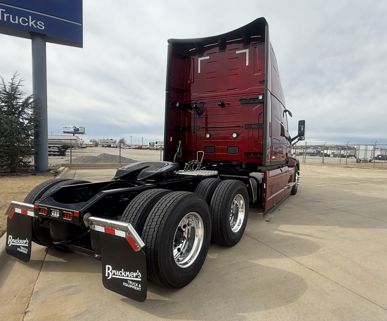 2026 Mack PR64T76H tractor truck rear view showing dual rear axles and red sleeper cabin